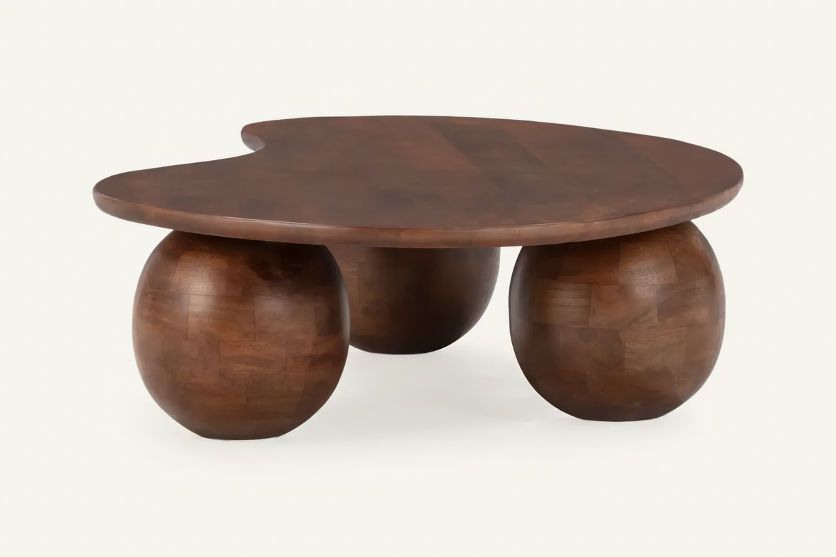The Procida Coffee Table, organic mango wood coffee table on spherical feet, studio view