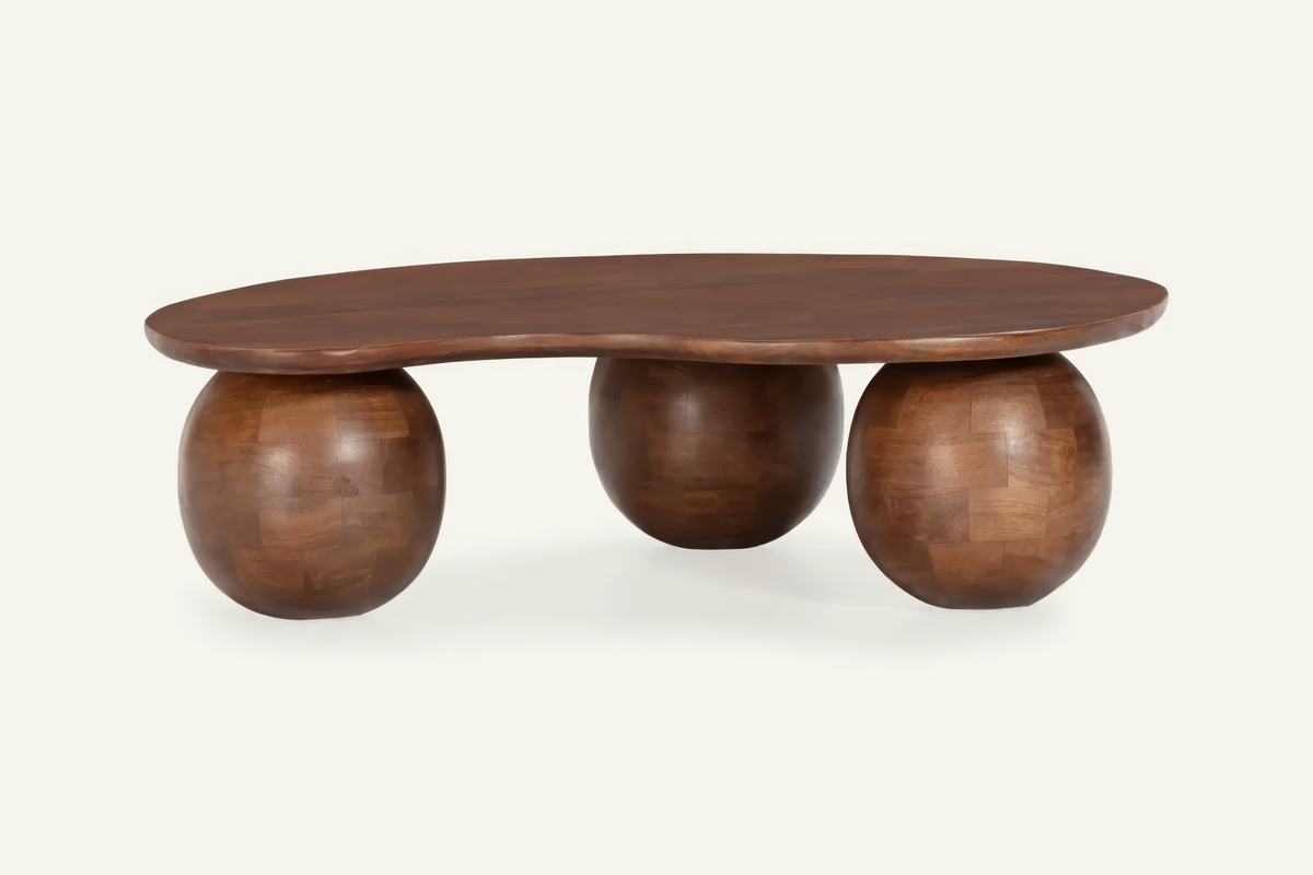 The Procida Coffee Table, organic mango wood coffee table on spherical feet, studio view