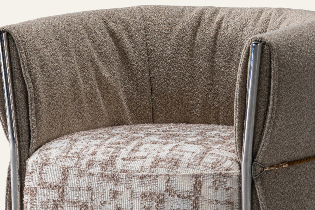The Rapallo Accent Chair, close-up of the shell, piping and patterned seat