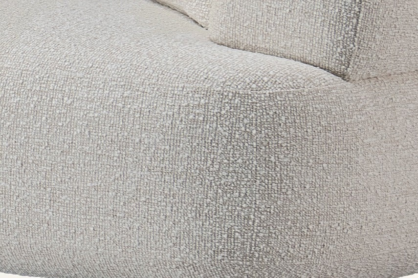 The Ravenna Curved Modular Sofa, close-up of the rounded end in ivory upholstery