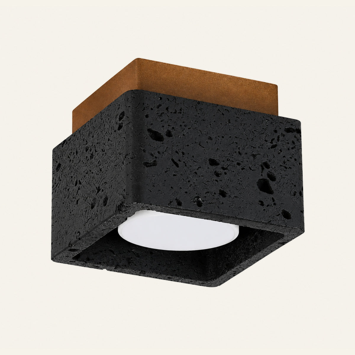 The Scatola travertine flush ceiling light, a square black stone box with a wood top, open underneath