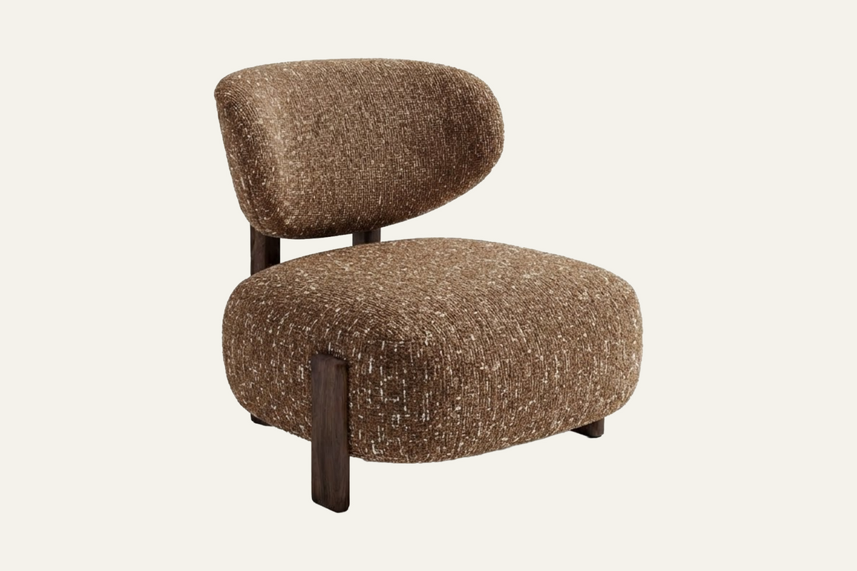 The Sirmione Lounge Chair in brown, low lounge chair in textured fabric on a walnut frame, studio view
