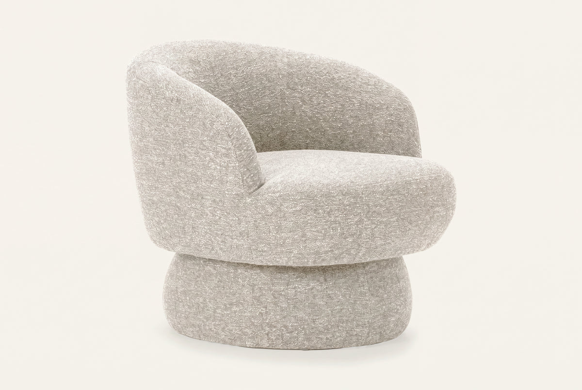 The Taormina Swivel Chair in stone, rounded boucle swivel chair, studio view