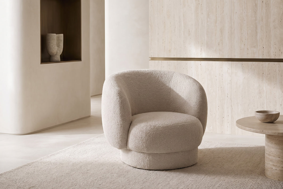 The Tivoli Swivel Chair in cream in a calm limewashed room