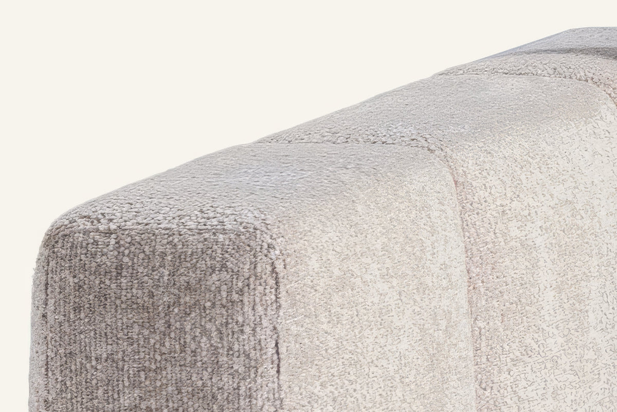 The Treviso Modular Sofa, close-up of the arm in pale grey weave