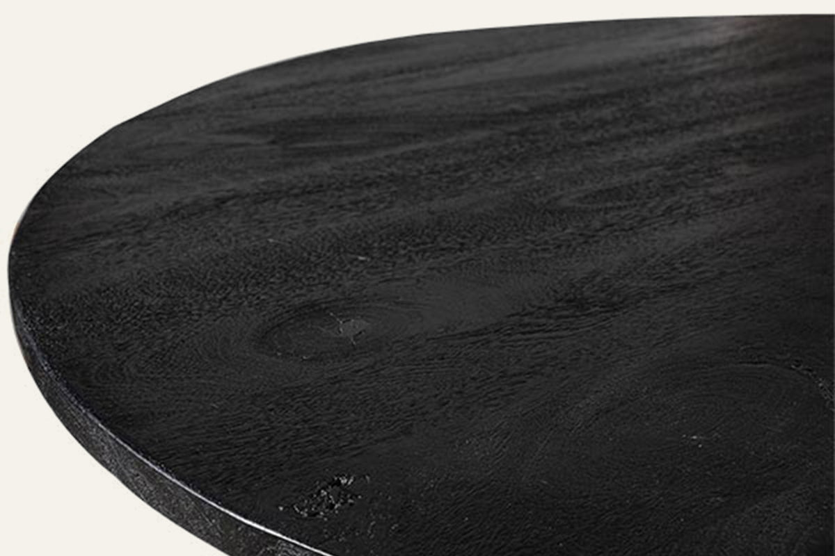 The Varese Round Dining Table, close-up of the black mango wood grain