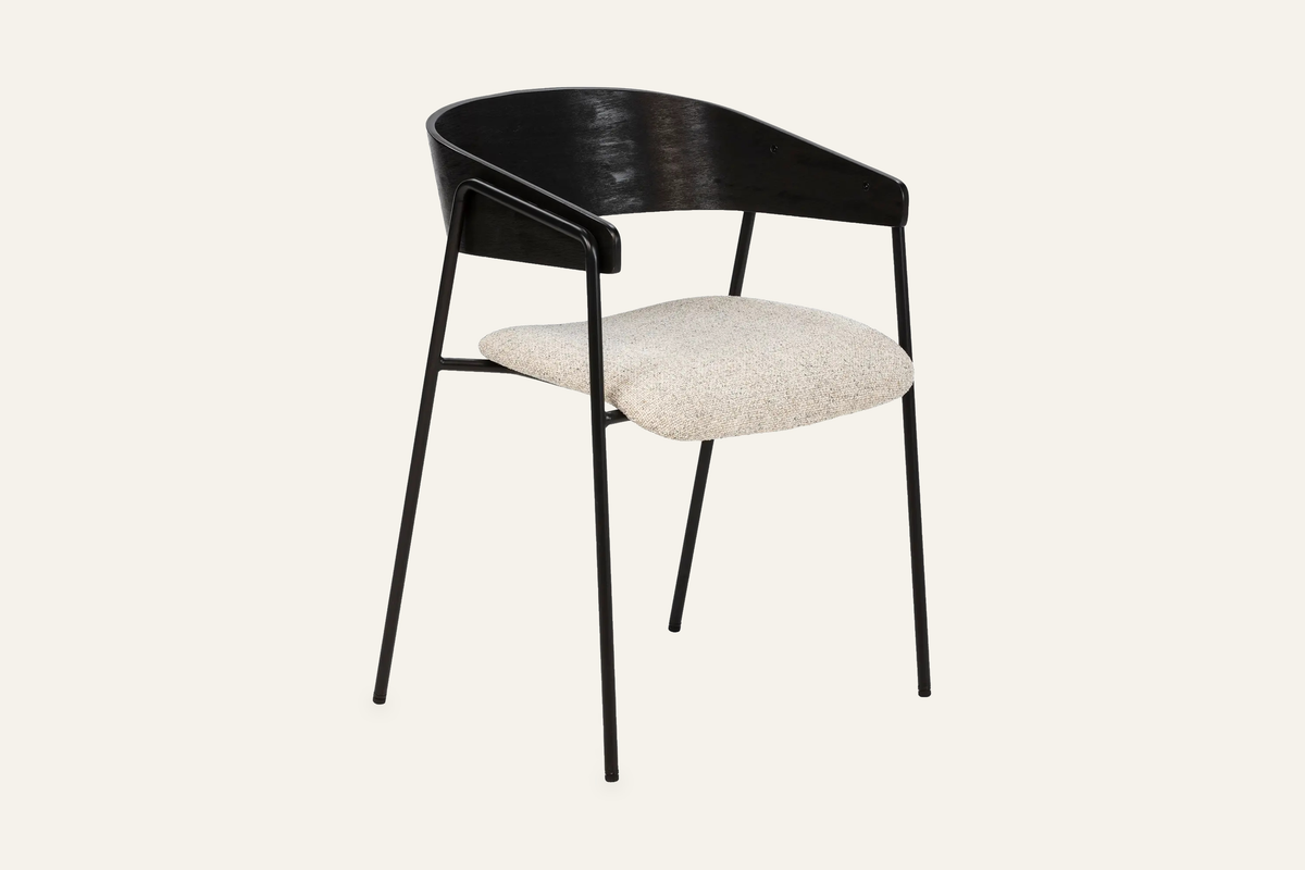 The Vernazza Dining Chair in black, dining chair with a curved wooden back on a metal frame, studio view