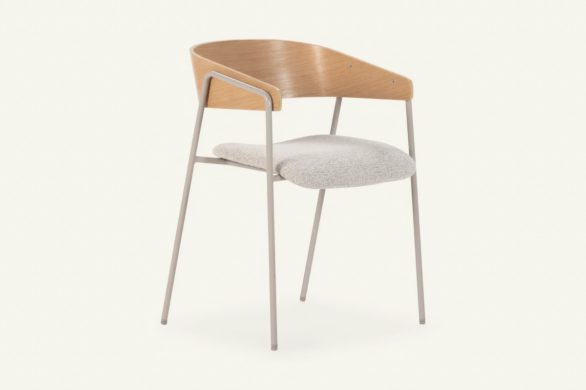The Vernazza Dining Chair in oak, dining chair with a curved wooden back on a metal frame, studio view