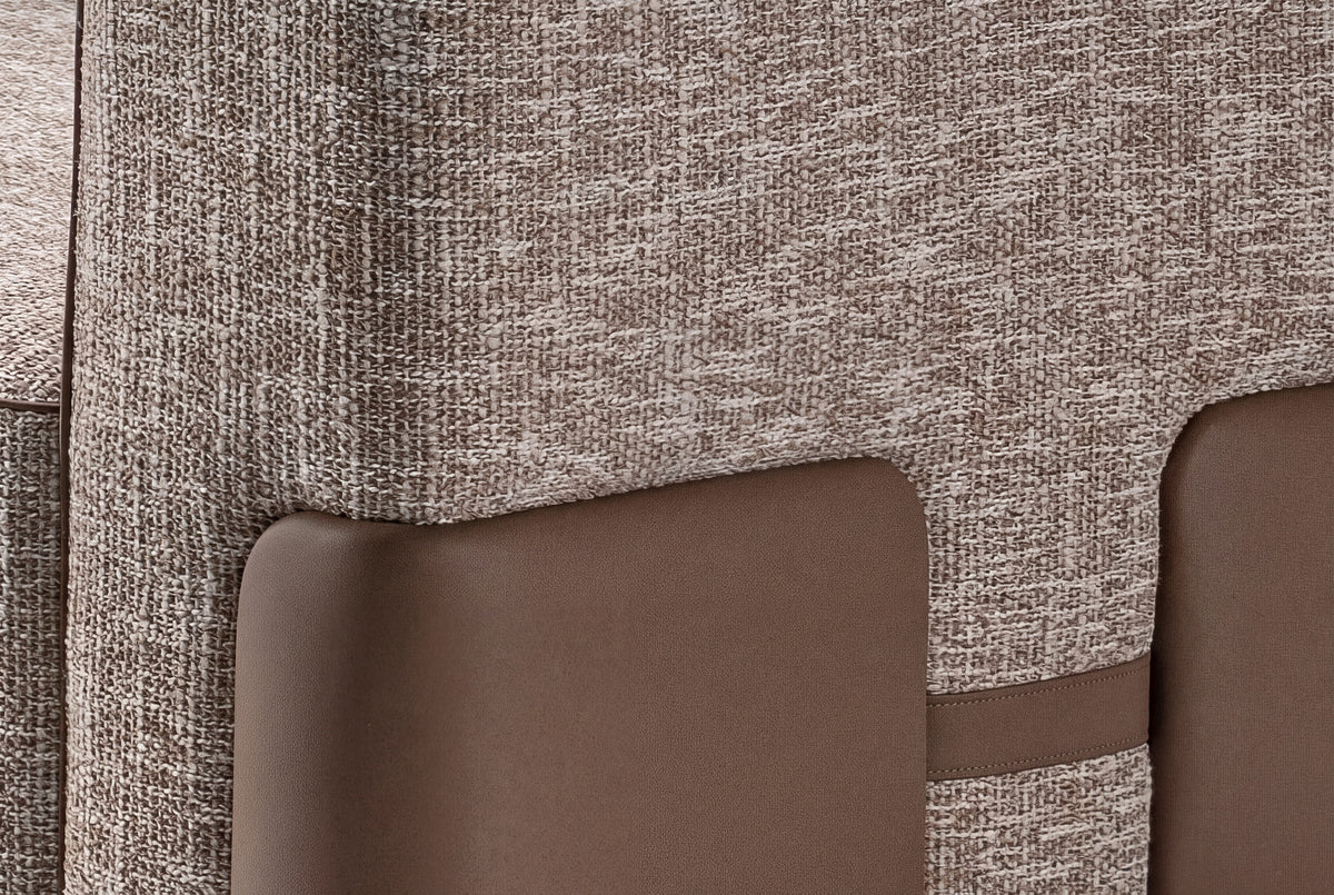 The Verona Modular Sofa, close-up of the leather-wrapped base and warm grey weave