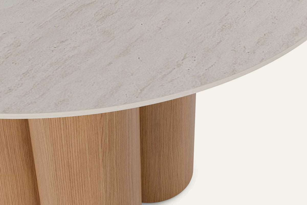 The Zoagli Travertine Finish Round Dining Table, close-up of the travertine-effect top