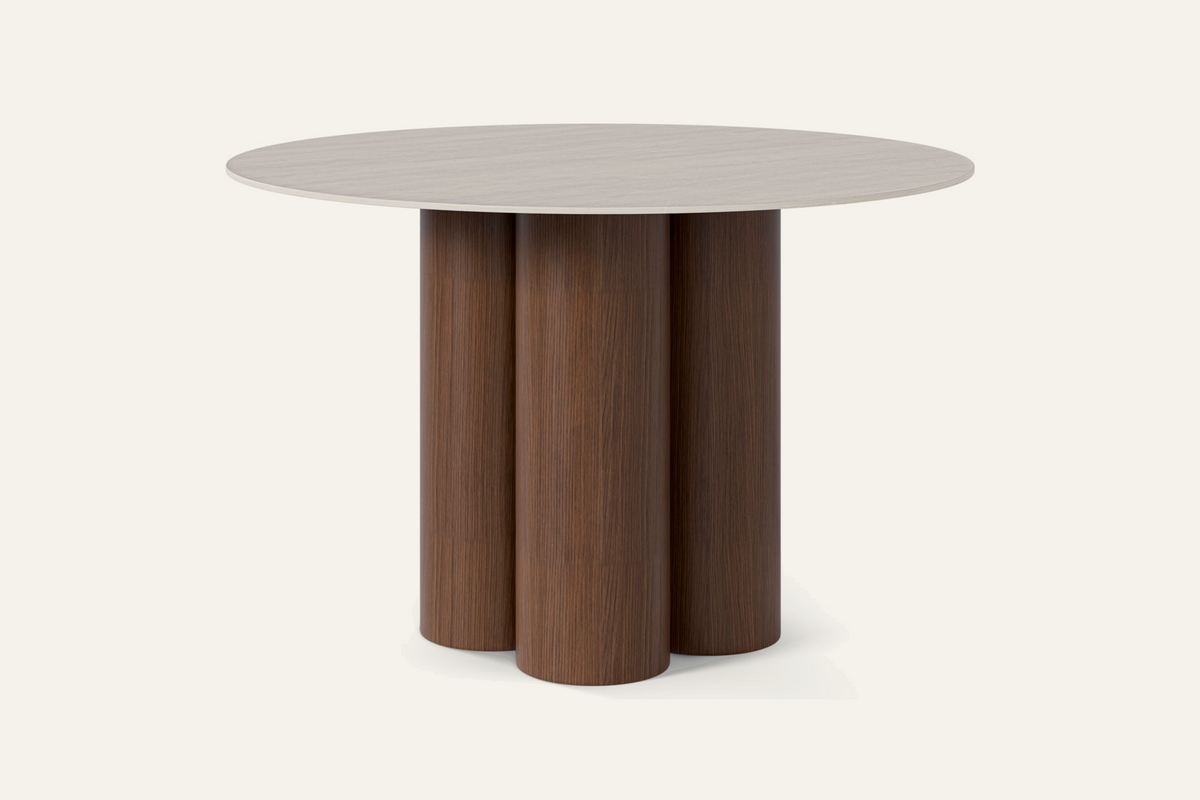 The Zoagli Travertine Finish Round Dining Table with walnut base