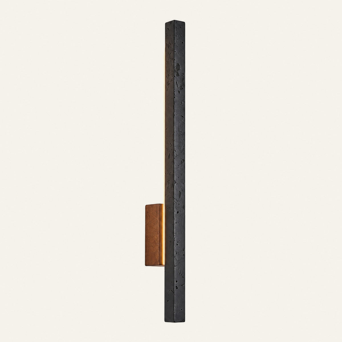 The Lama travertine wall light in black travertine