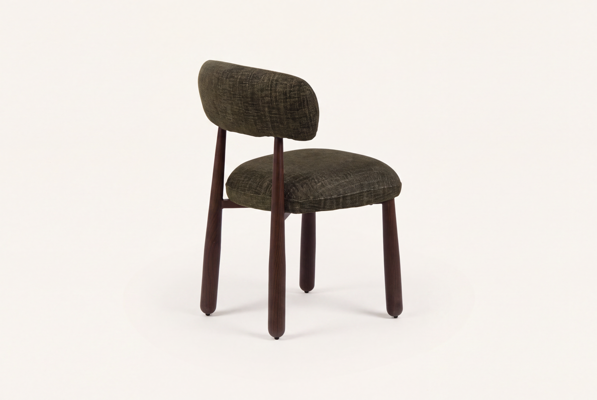 The Mantova Dining Chair in forest green and walnut, three-quarter back view