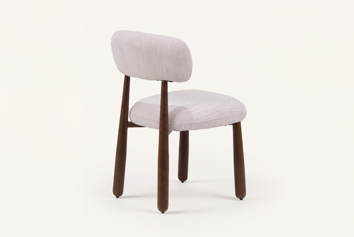 The Mantova Dining Chair in ivory and walnut, three-quarter back view