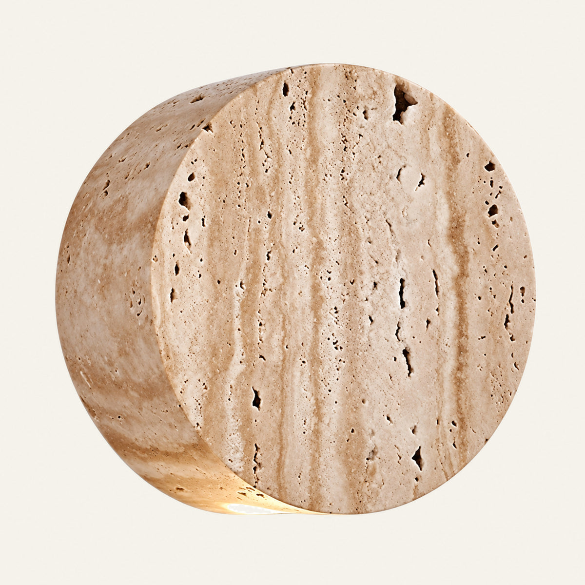 The Medaglia travertine wall light front view