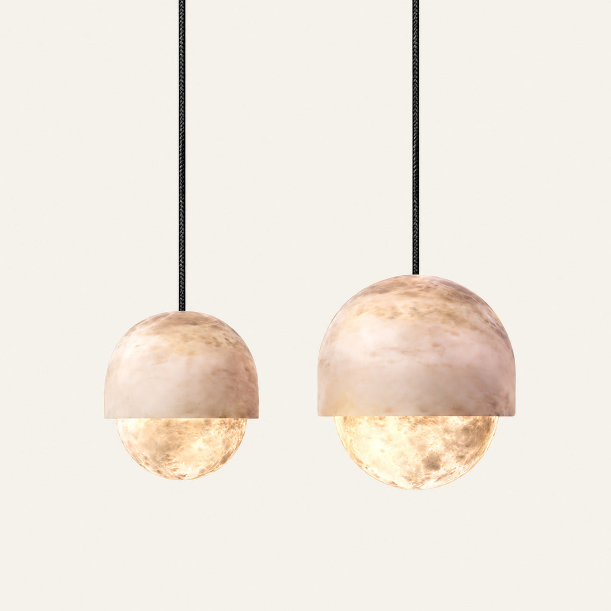 The Medusa alabaster pendant light shown in both sizes