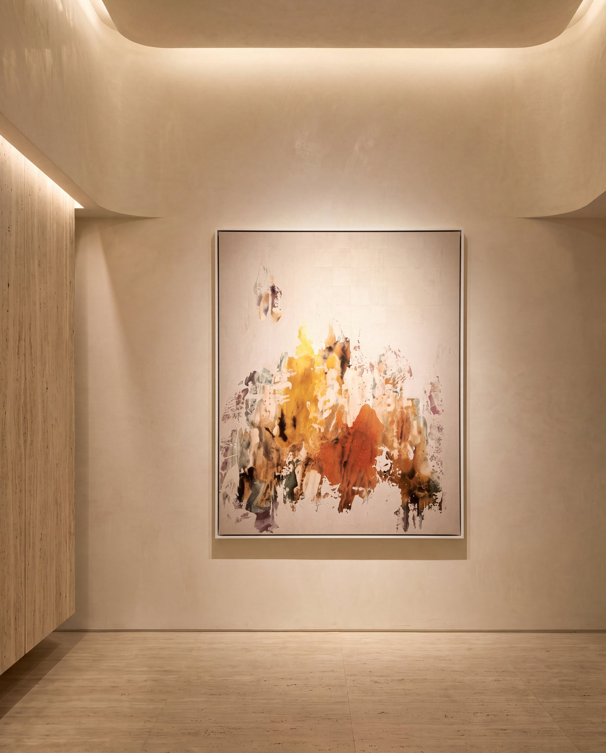 Murano canvas artwork in a white frame on a plaster wall