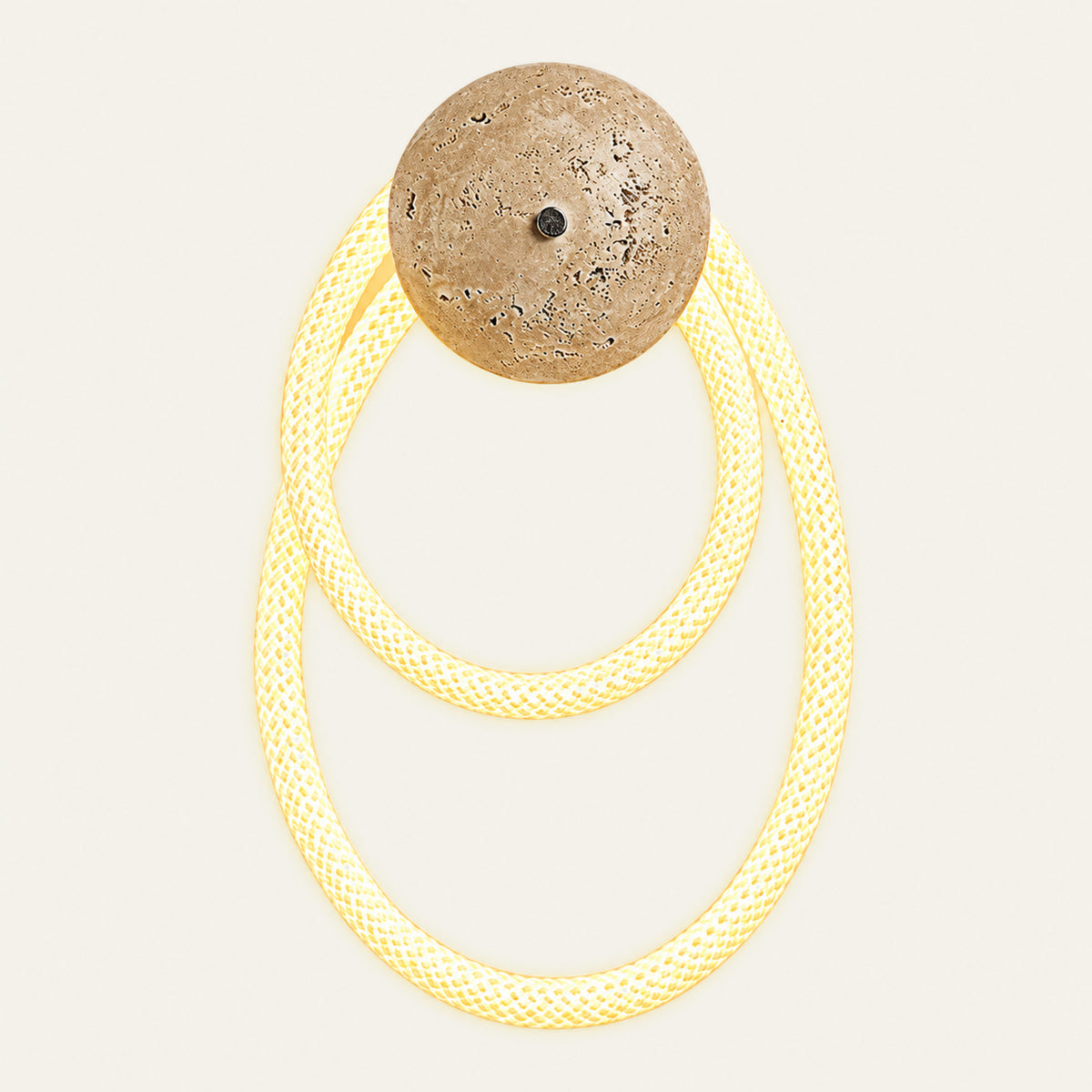 The Nastro travertine wall light, double loop
