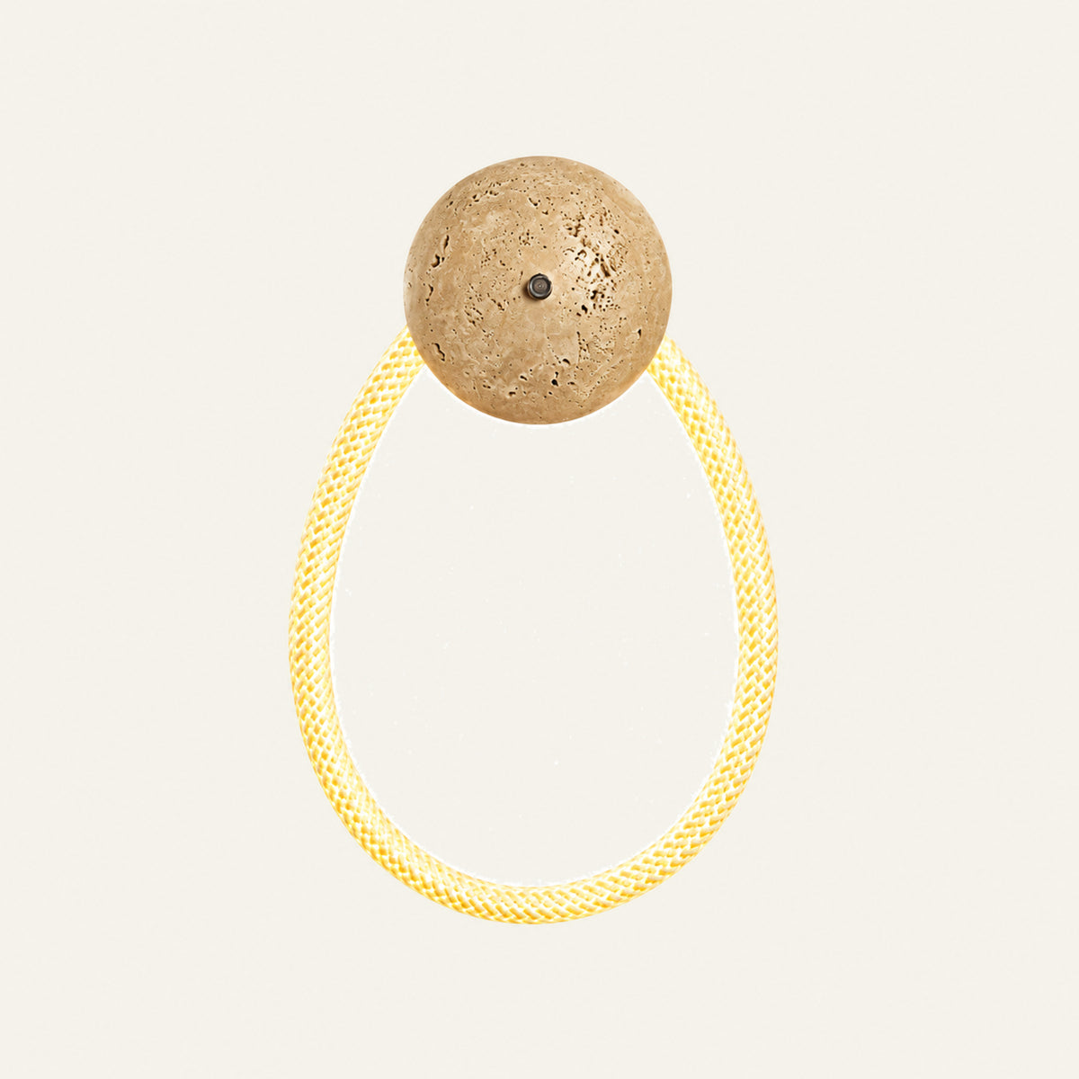 The Nastro travertine wall light, single loop