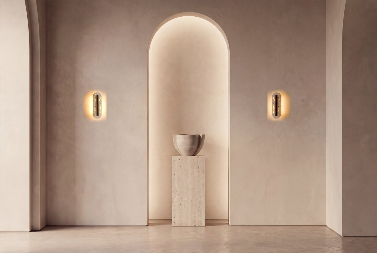 The Navetta Travertine Wall Light, a pair either side of an arched plaster niche