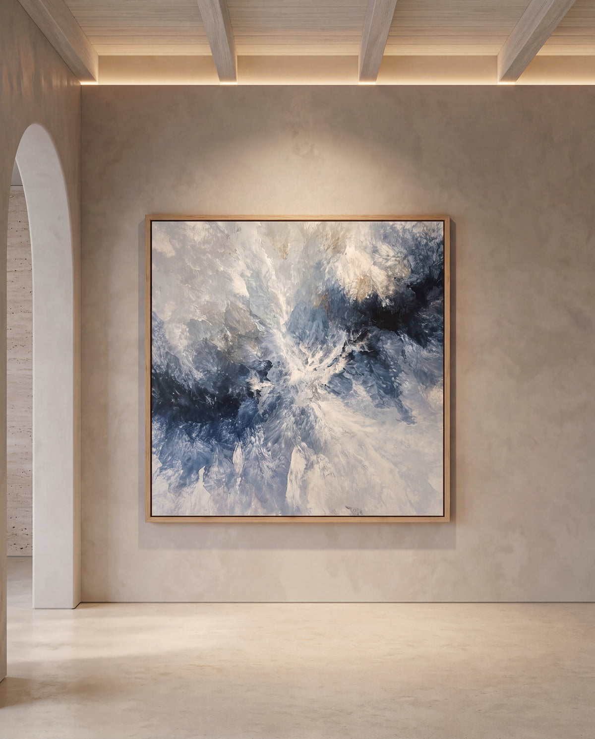 Ocean Navy canvas artwork in an oak frame on a plaster wall