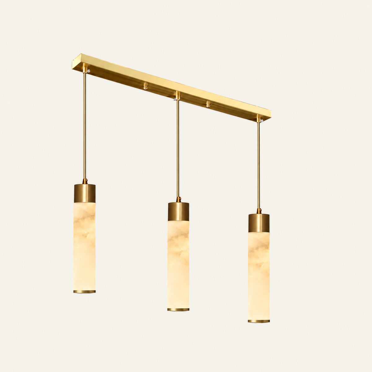 The Organo alabaster pendant light, linear bar of three in brass