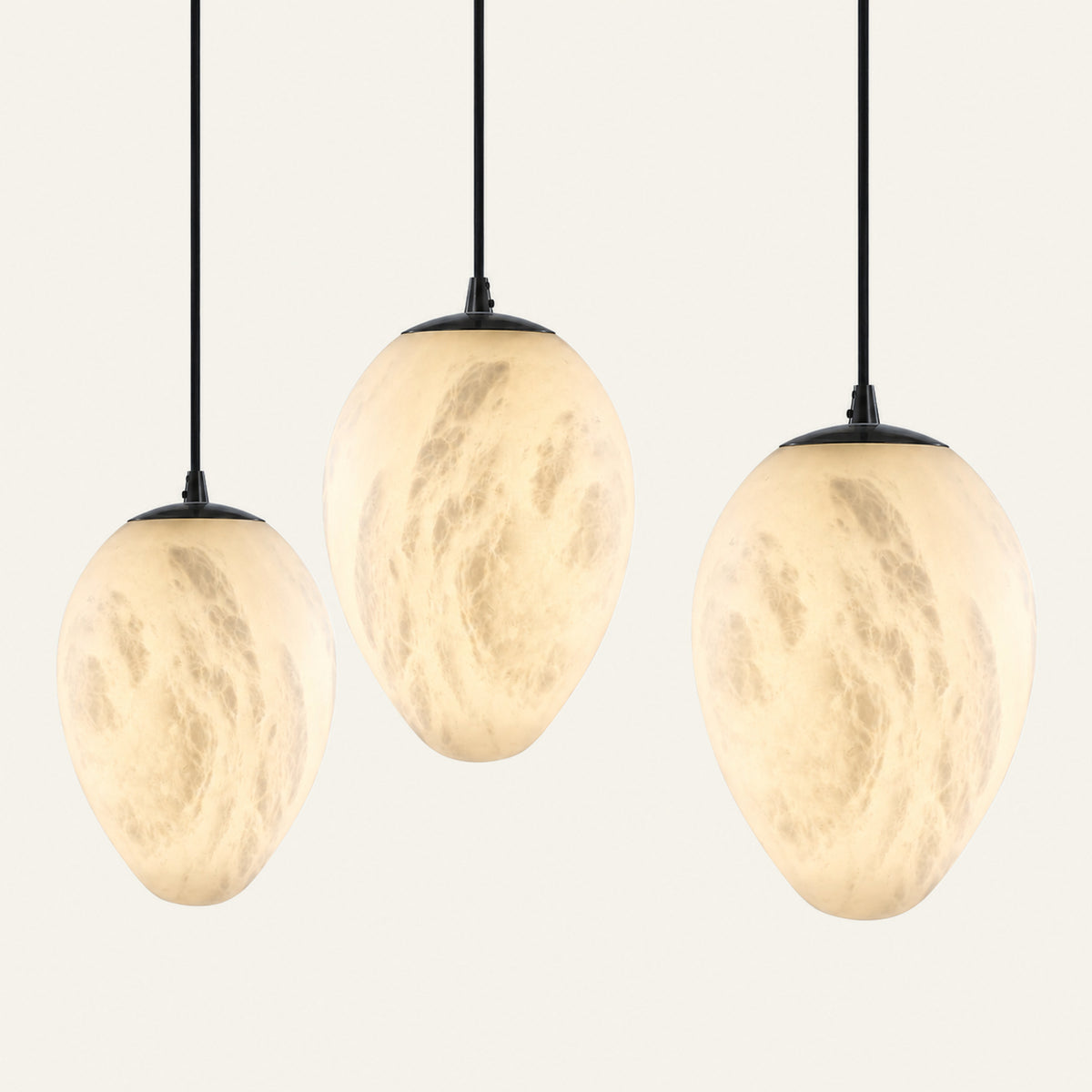 The Ovale alabaster pendant light shown in all three sizes