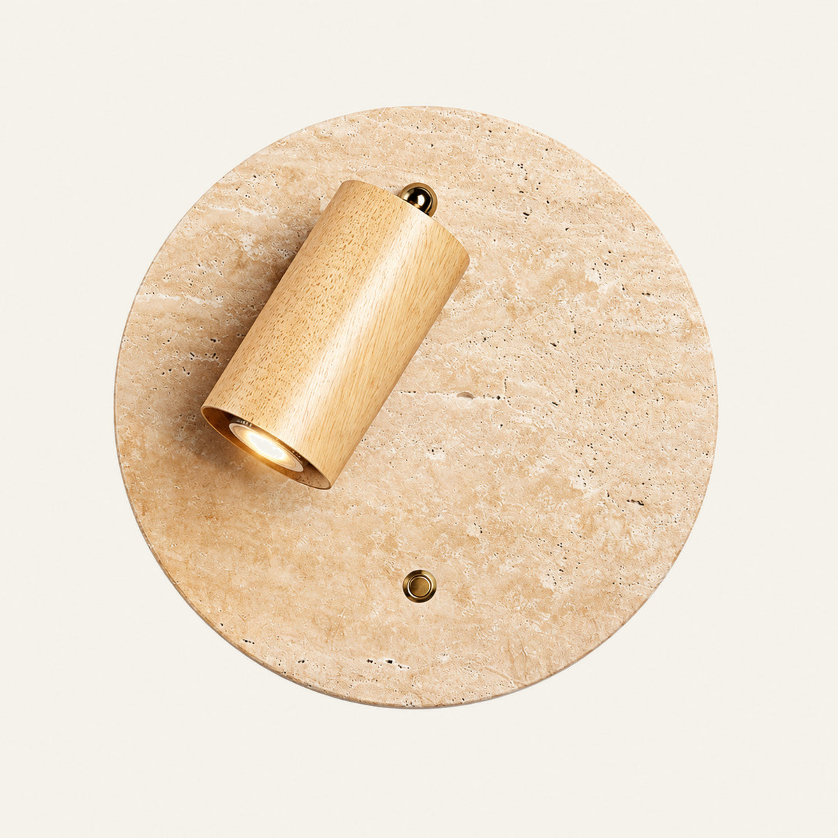 The Piatto travertine wall light, round, with a natural oak spotlight