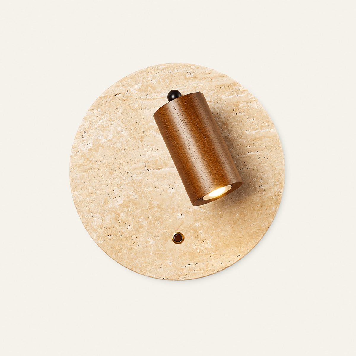 The Piatto travertine wall light, round, with a walnut spotlight
