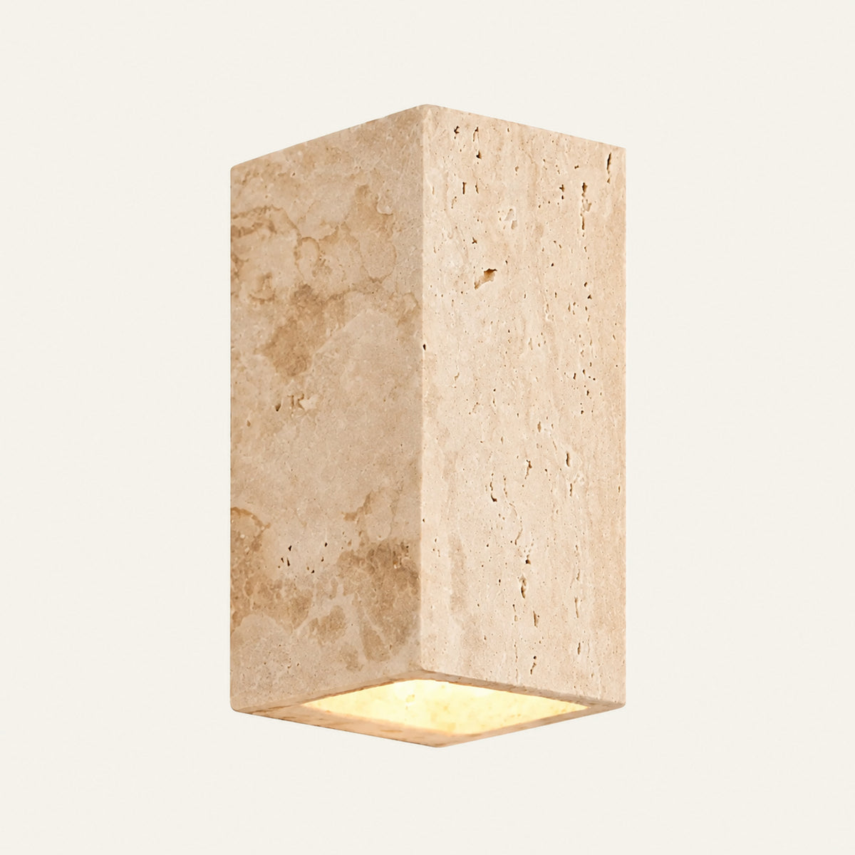 The Pilone travertine wall light, a tall stone block, indoor version