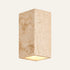 The Pilone travertine wall light, a tall stone block, indoor version
