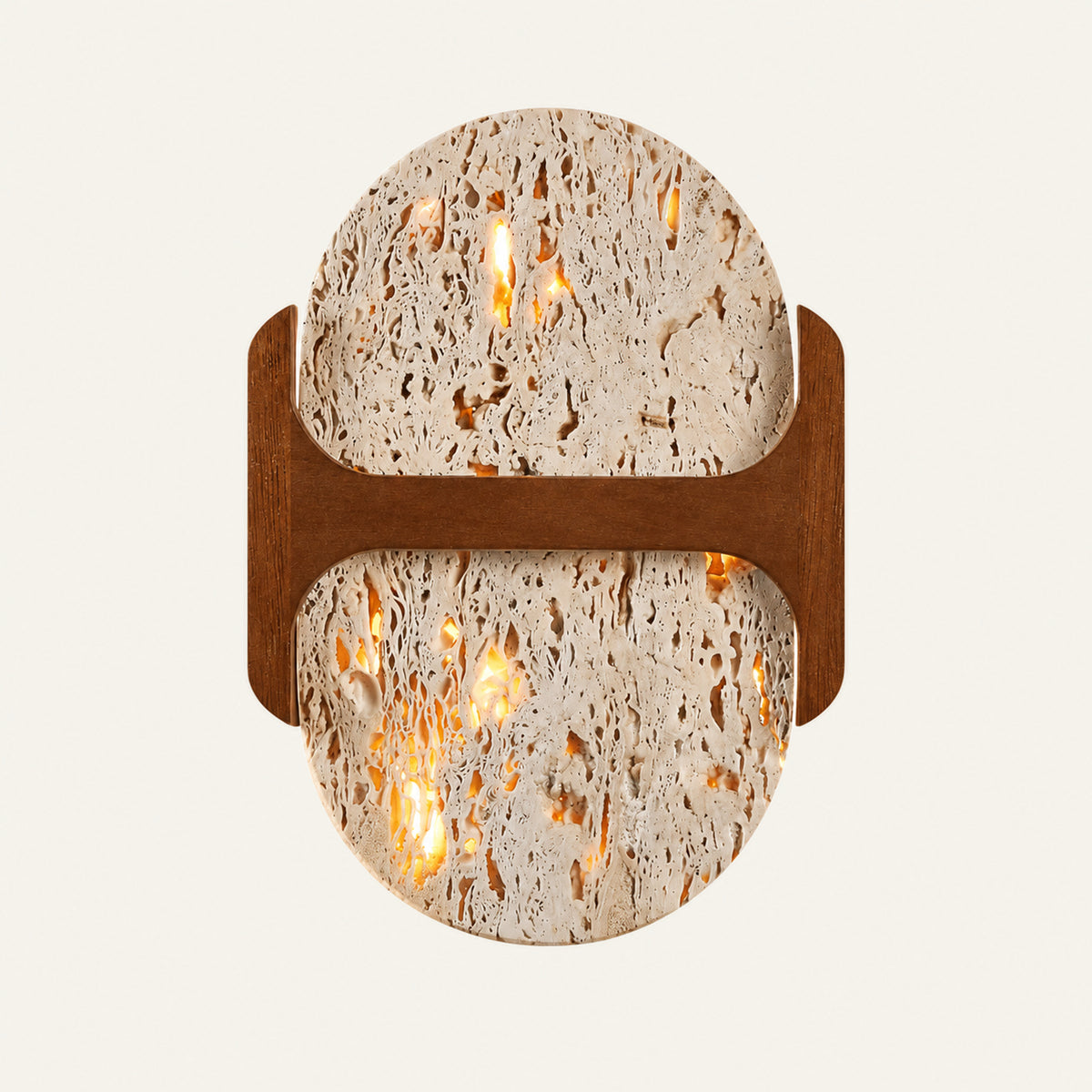 The Ponticello travertine wall light, a rounded stone slab crossed by a walnut bridge