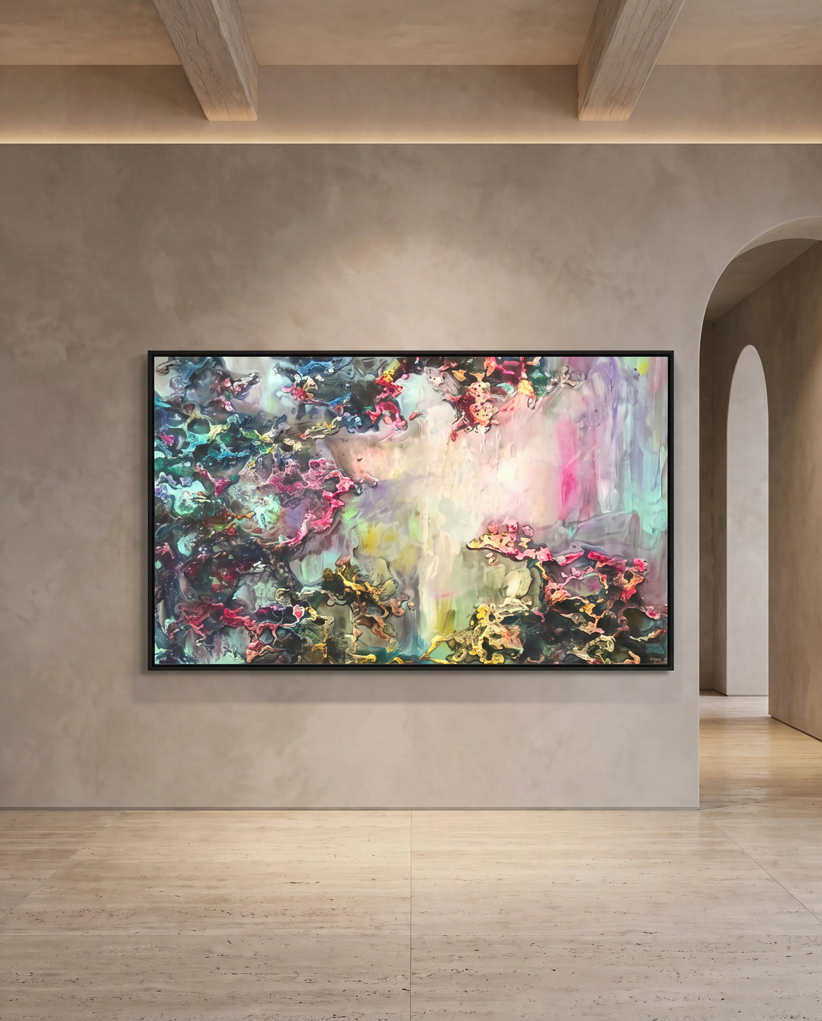 Solenne canvas artwork in a black frame on a plaster wall