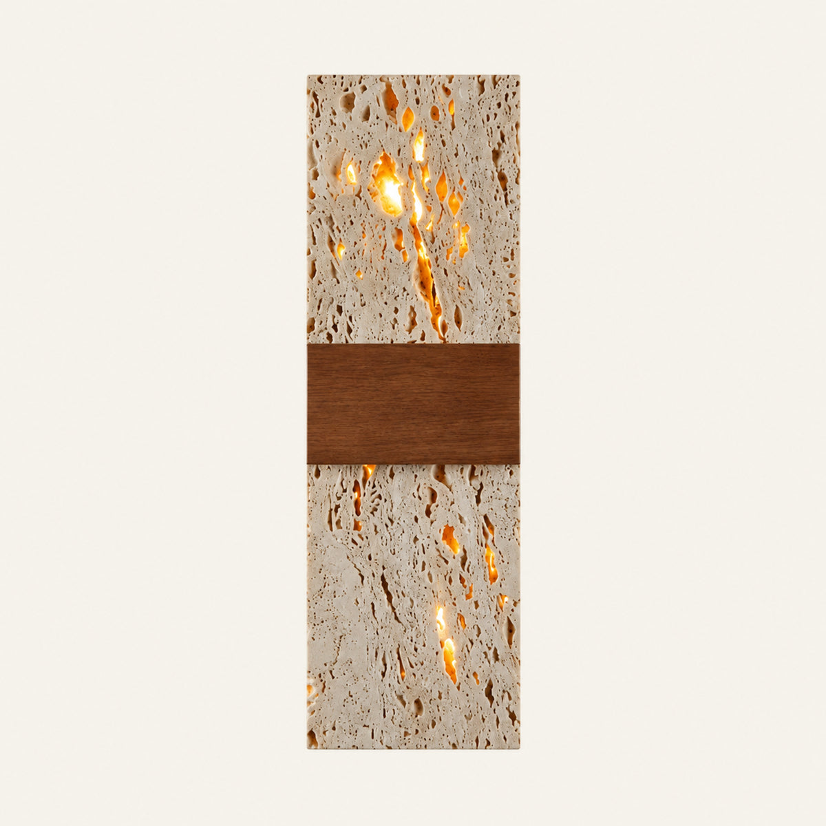 The Tassello travertine wall light, a tall square-cut stone slab crossed by a broad walnut band and lit from behind