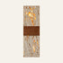 The Tassello travertine wall light, a tall square-cut stone slab crossed by a broad walnut band and lit from behind