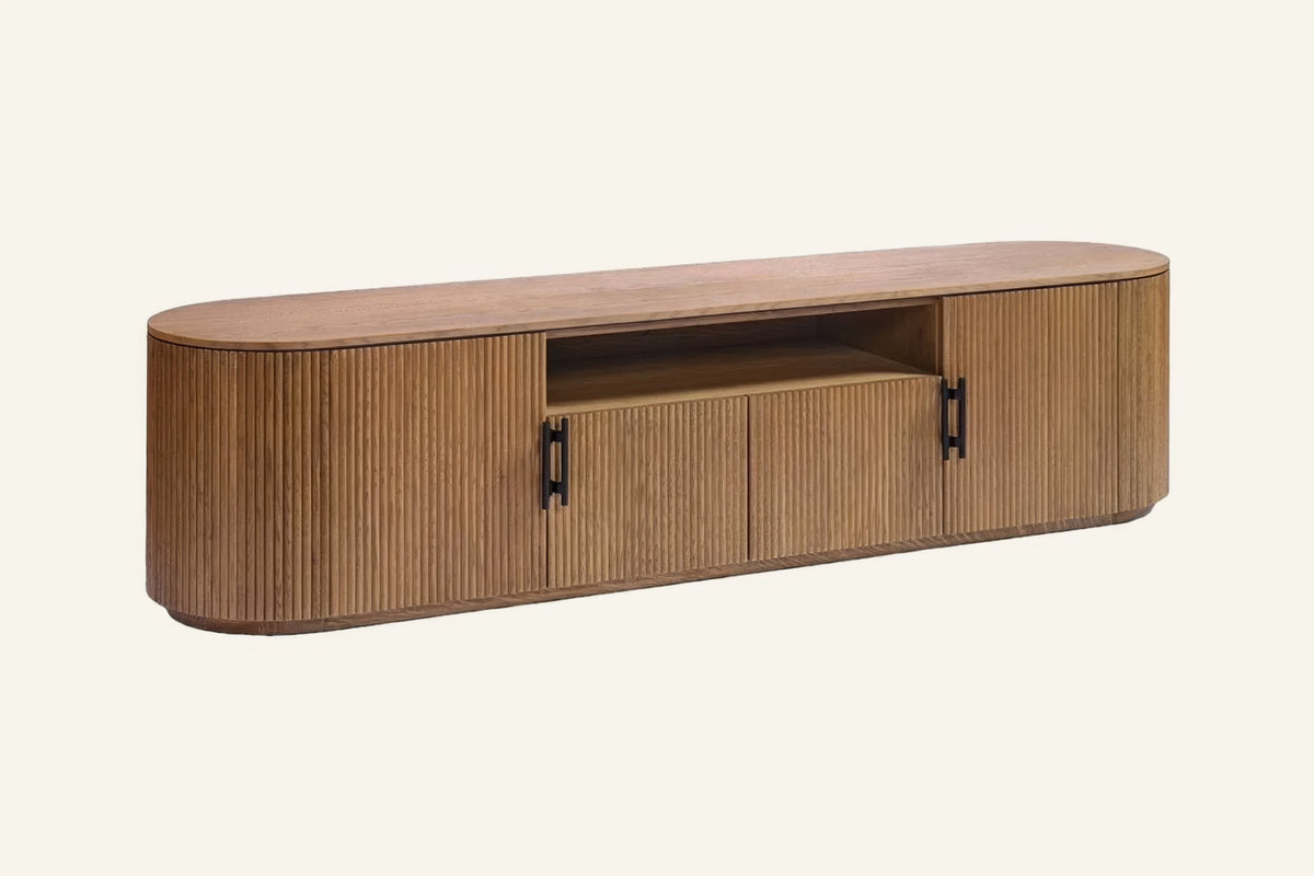 The Assisi Oval Sideboard in fluted oak finish, angled view