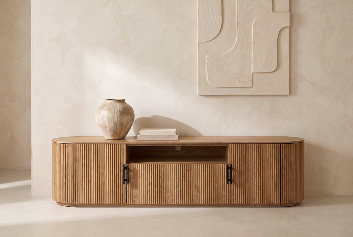 The Assisi Oval Sideboard against a limewashed wall