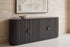 The Bevagna Fluted Marble Sideboard against a travertine wall