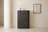 The Bevagna Fluted Marble Tallboy in dark ash against a pale plaster wall