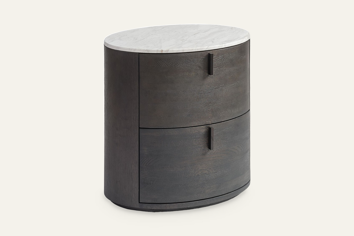 The Bolsena Oval Stone Bedside Table, angled view