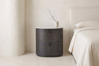 The Bolsena Oval Stone Bedside Table