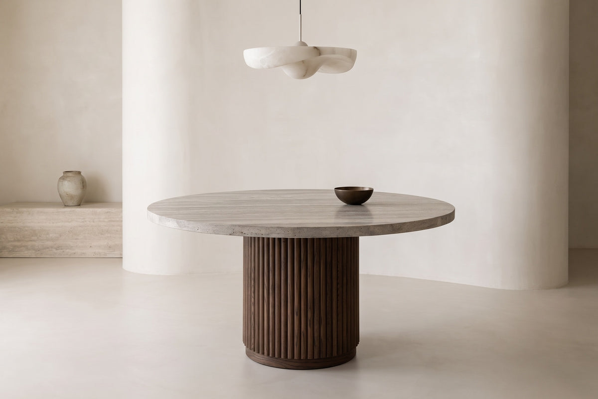 The Chiusi Travertine Round Dining Table in a dining room setting
