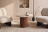 The Chiusi Travertine Side Table in a living room setting