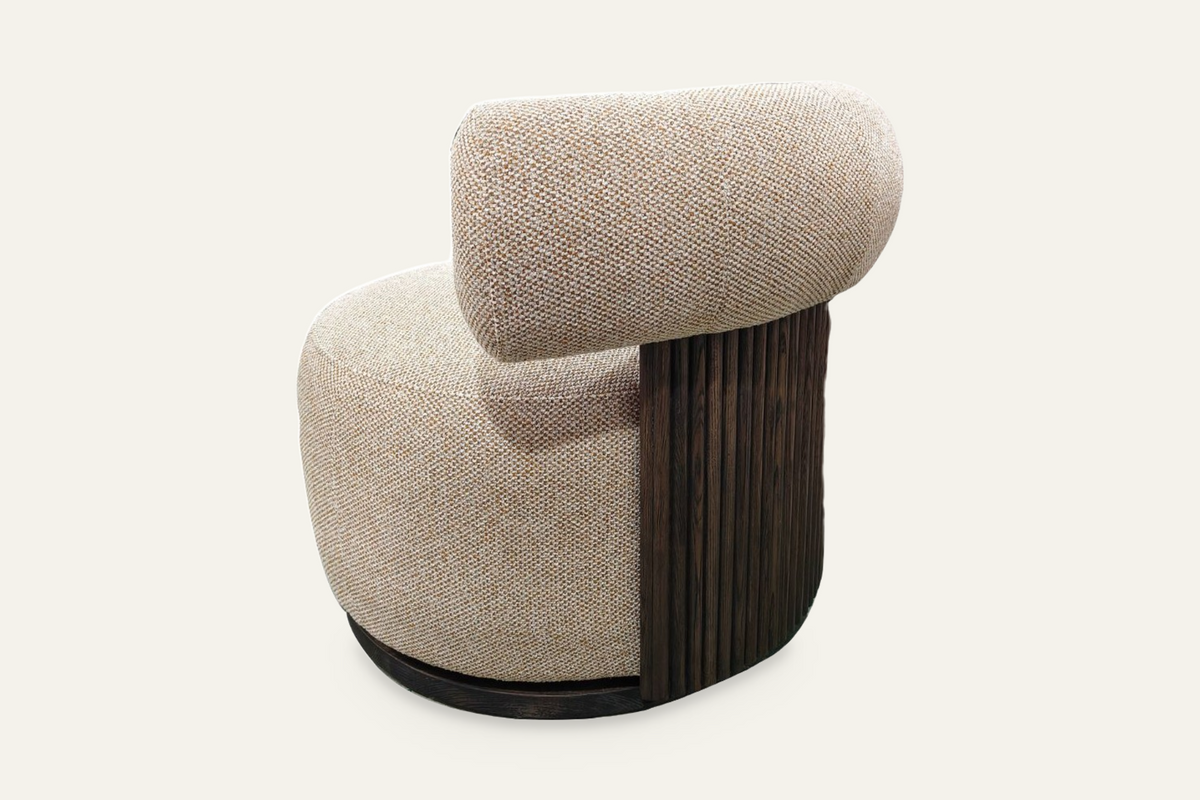 The Cortona Swivel Chair showing the fluted timber back, angled rear view