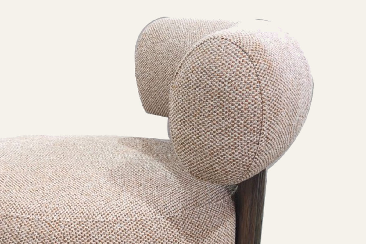 The Cortona Swivel Chair in toasted beige, close-up of the weave and bolster