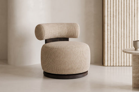 The Cortona Swivel Chair in toasted beige textured weave in a living room setting