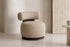 The Cortona Swivel Chair in toasted beige textured weave in a living room setting