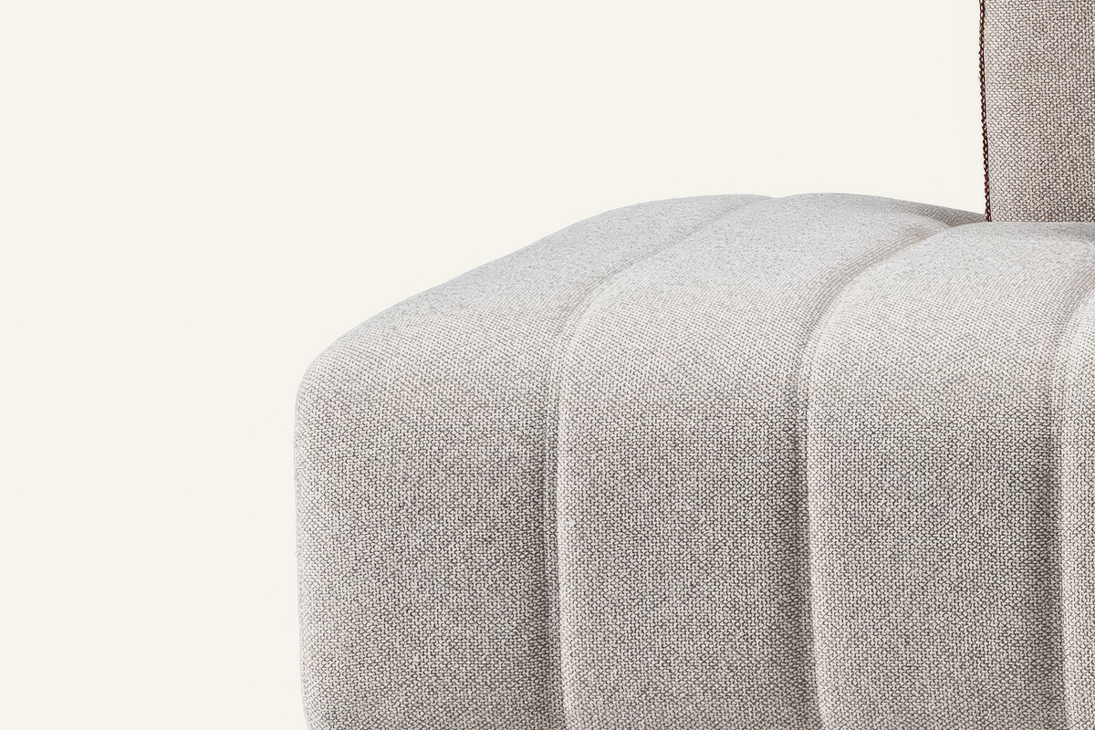 The Lucca Chaise Sofa, close-up of the channelled seat and piped arm