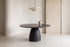 The Murlo Stone Round Dining Table in a dining room setting