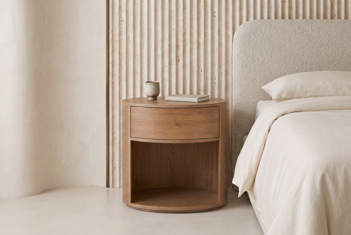 The Ostuni Oak Bedside Table in a bedroom setting